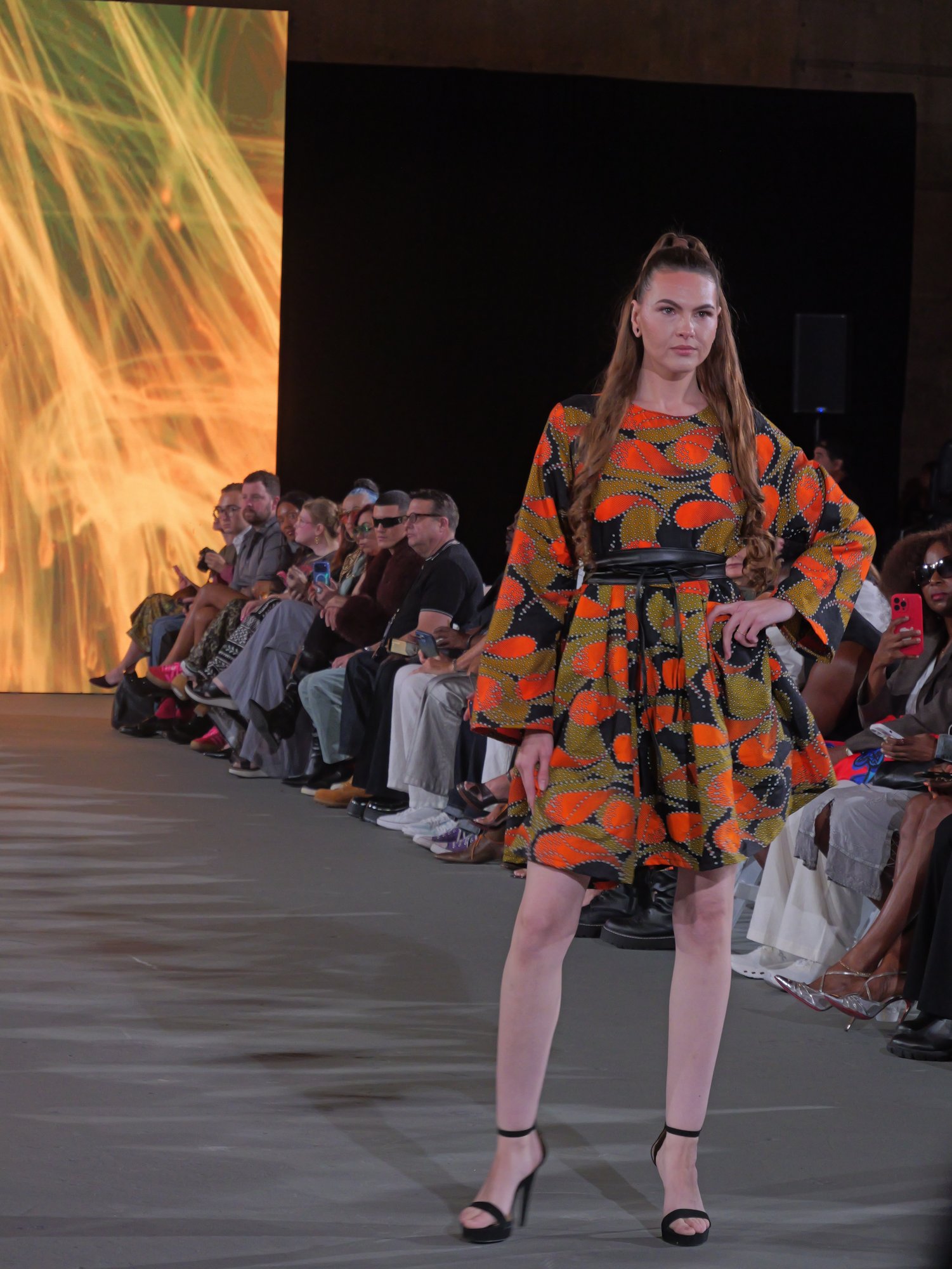 A Sewreffic look: orange, olive and black print dress with bell sleeves and a wide black belt