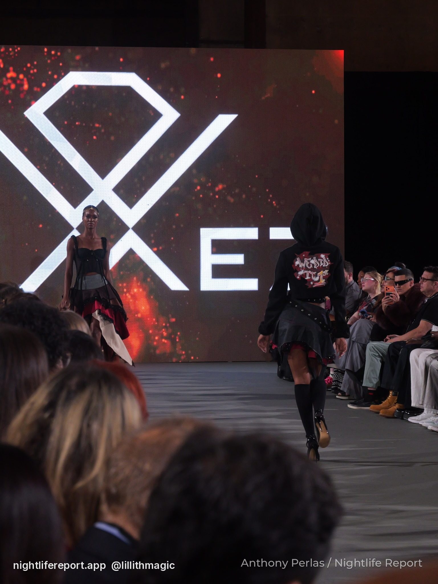 A model walks the runway in front of the Dimez LED wall at The Bureau Fashion Week LA