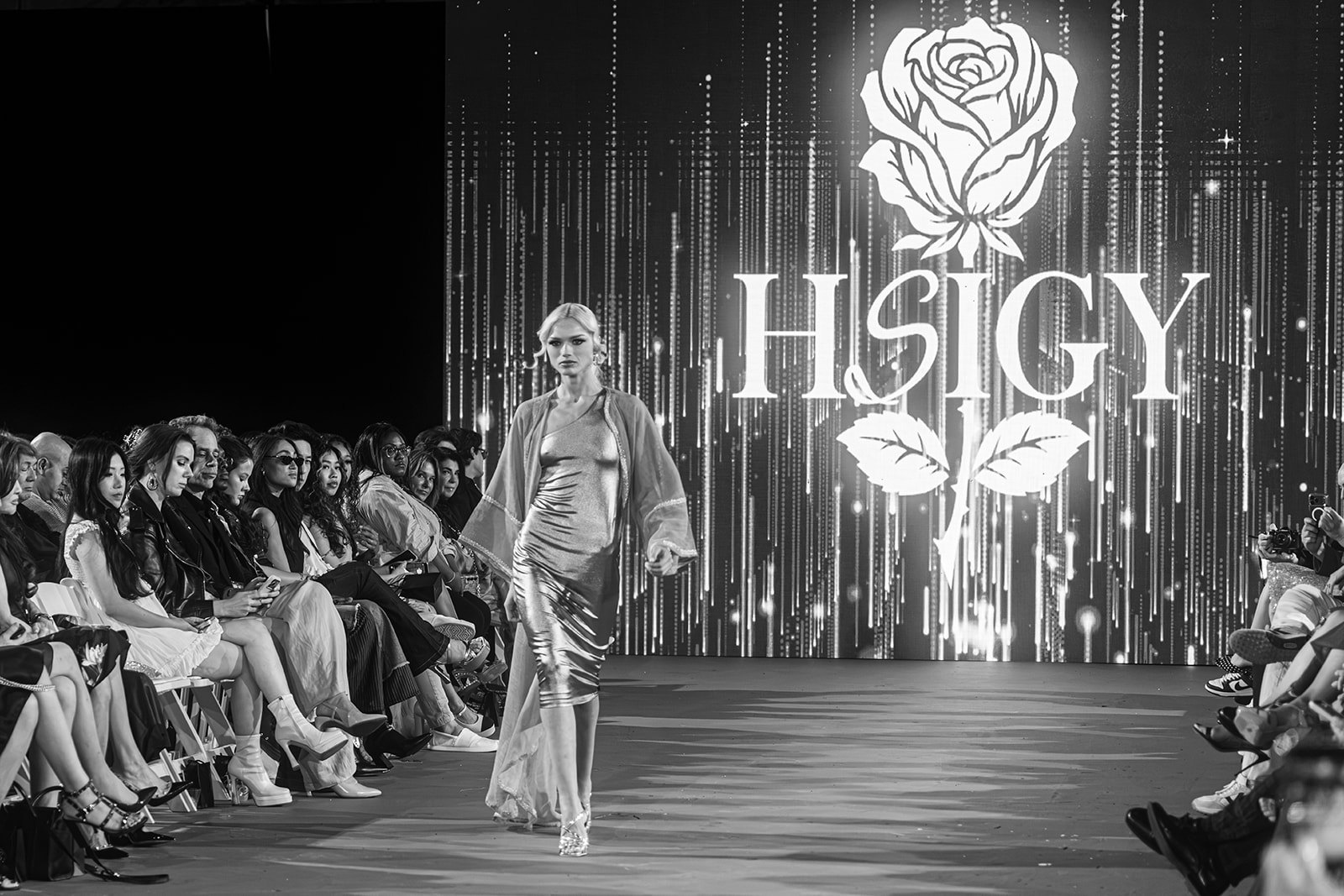 Emily Sophie Christine walking the Hey Sis! I Got You! runway at The Bureau Fashion Week LA in a metallic slip dress and sheer duster, black and white