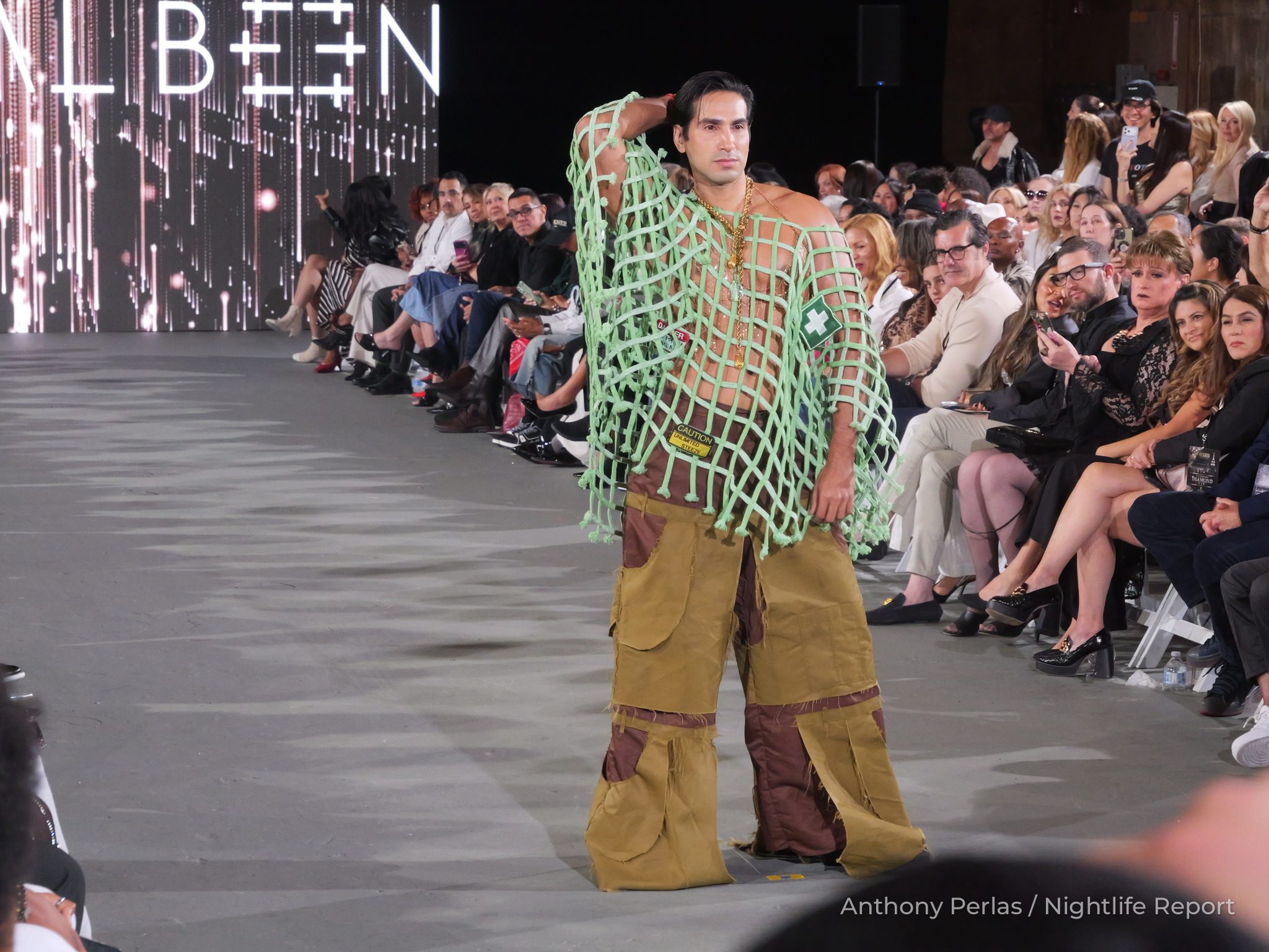 Runway look by Eternal Been at The Bureau Fashion Week LA, The Finale: mint open-net top with tan cargo trousers.