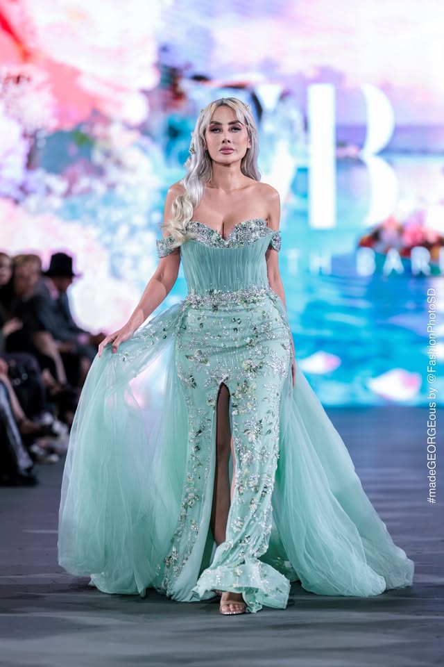 Mirka Howard (@mirhoward28) on the runway at The Bureau Fashion Week in a mint embellished gown with a tulle overskirt. Photo courtesy of Mirka Howard.