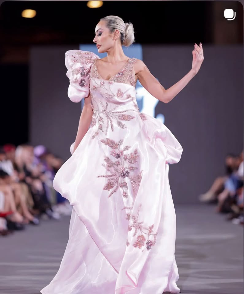 Mirka Howard (@mirhoward28) on the Justin Zachary runway in the blush floral-embroidered gown, Bureau Fashion Week LA 2026. Photo courtesy of Mirka Howard.