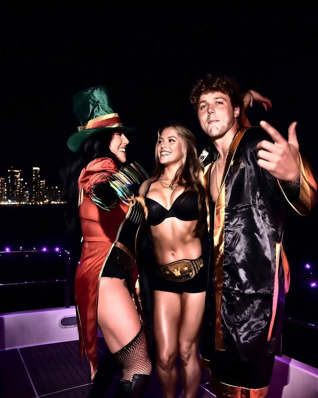 Three guests in costume on a yacht deck at night, Long Beach skyline behind