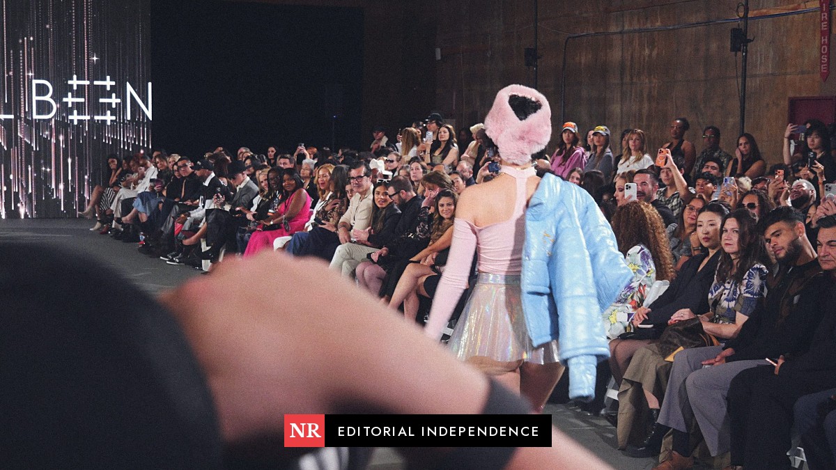 A photographer's camera in the foreground at The Bureau Fashion Week LA runway