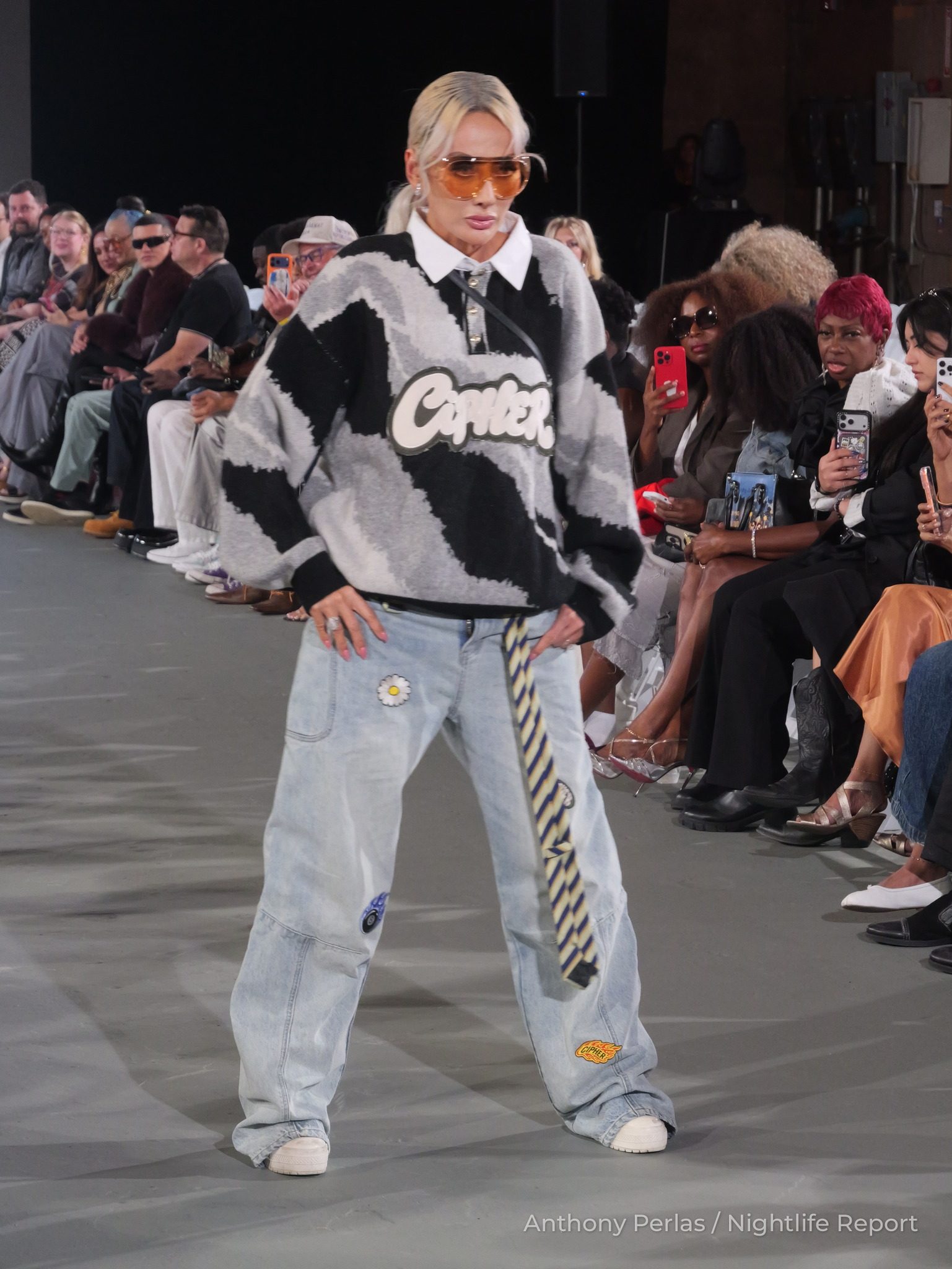 Runway look by X-X Co. at The Bureau Fashion Week LA, The Opening: black and white graphic sweater, striped tie and wide light-wash jeans.