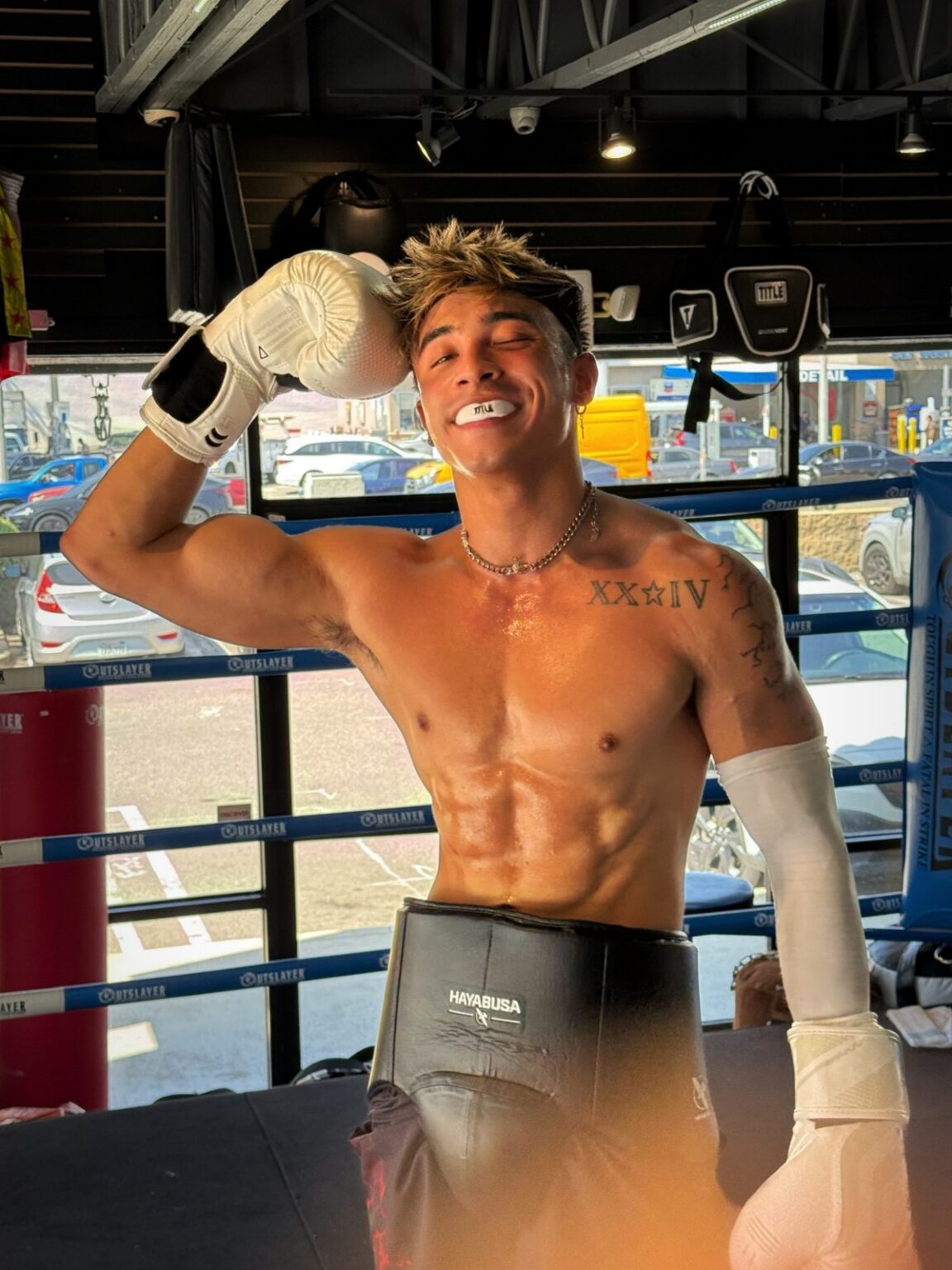 Zack Bernz in the boxing gym, gloves up